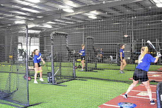 Blinn softball players practicing in the new Coatney Center
